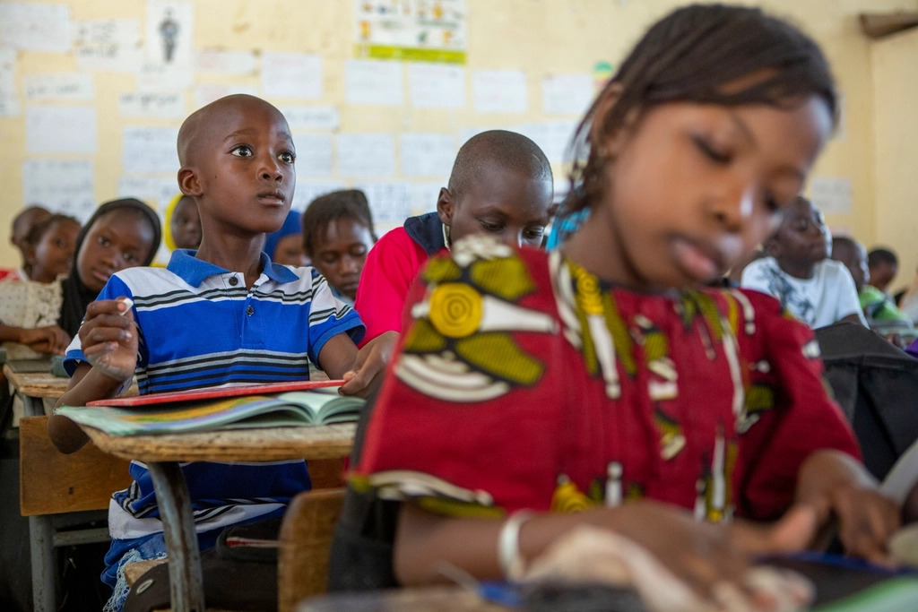 Children seated together in an early-education classroom